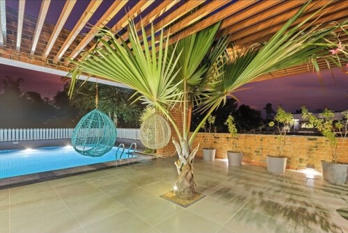 A beautiful & Green Farmhouse with a private Swimming pool & Garden .