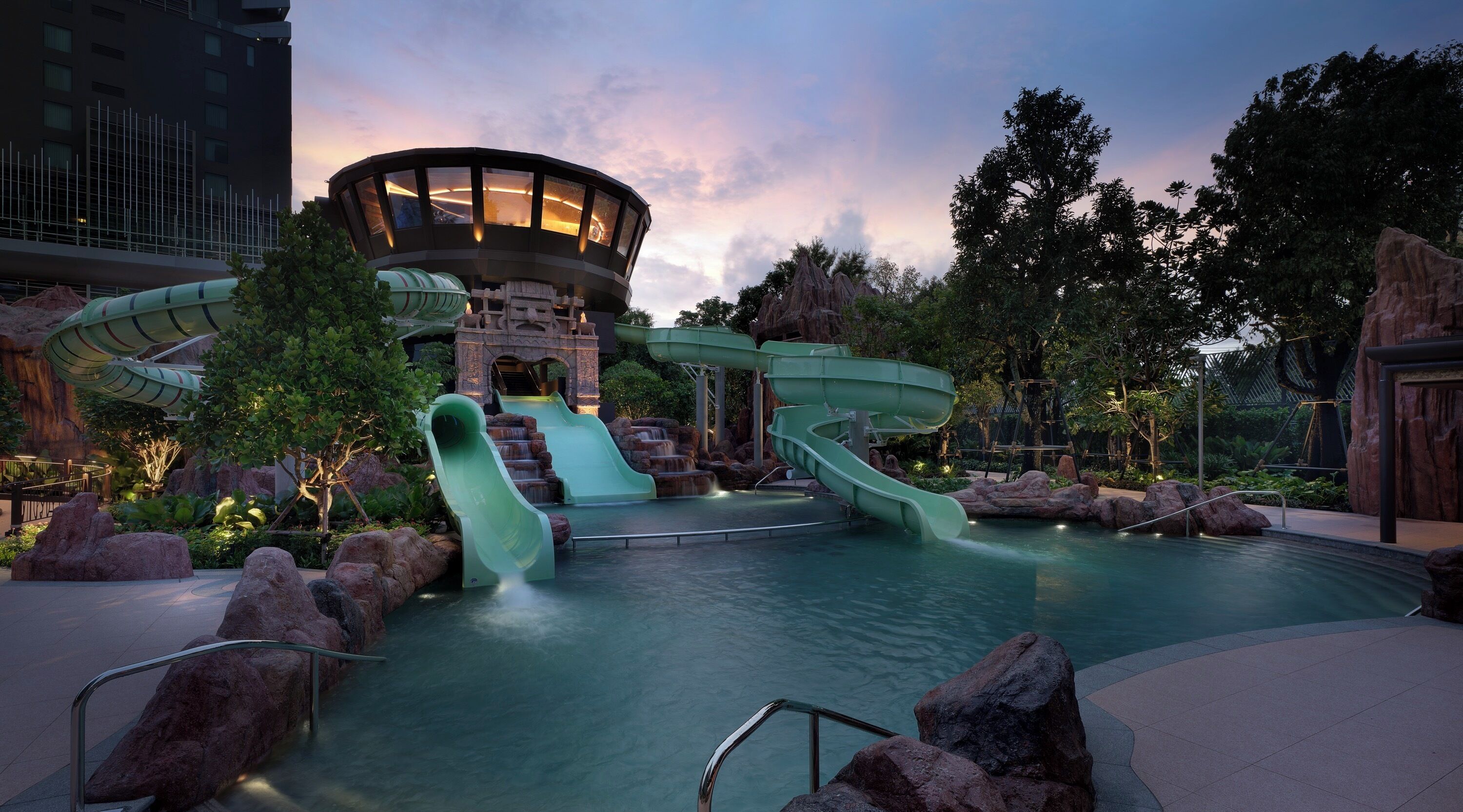 A water park with multiple slides and a pool area.