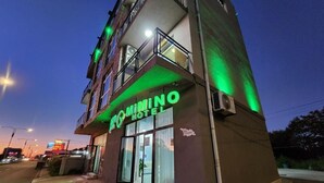 A hotel with a prominent sign, a balcony, and a visible entrance. - Hotel Mimino & Restaurant (Batumi)