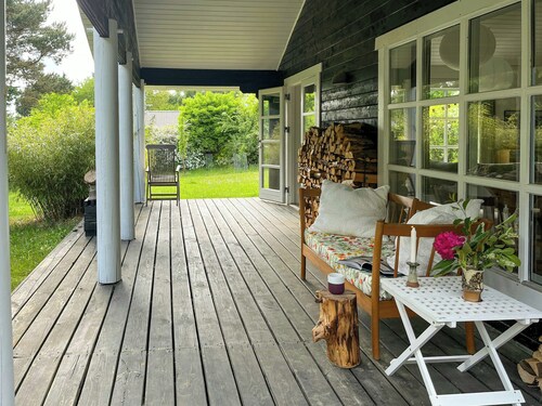 Summer house with path to pier by fjord