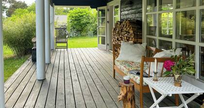 Summer house with path to pier by fjord