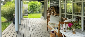 Summer house with path to pier by fjord