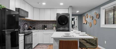 Fridge, microwave, stovetop, coffee/tea maker