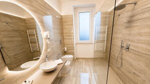 A modern bathroom with a curved vanity, two sinks, a shower, and a window. - Valentina Rooms – Elegant Stay in Bronte, Pistacchio e Etna. (Bronte)