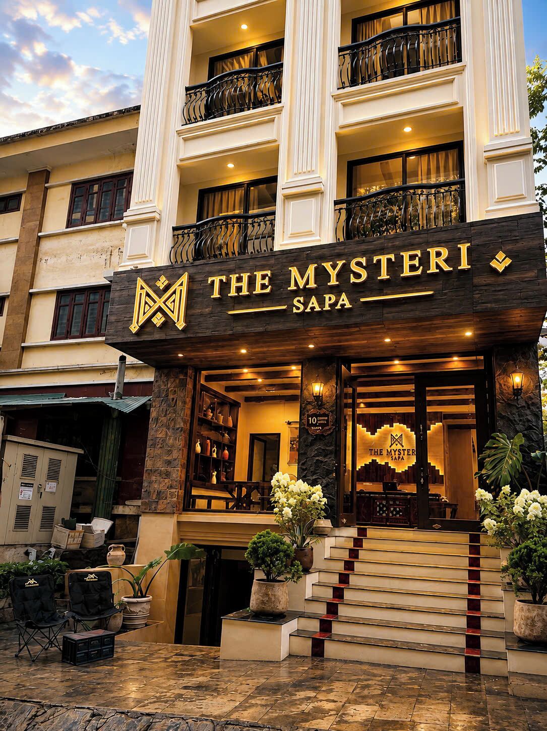 A hotel entrance with a sign reading 'The Mysterii Sapa.'