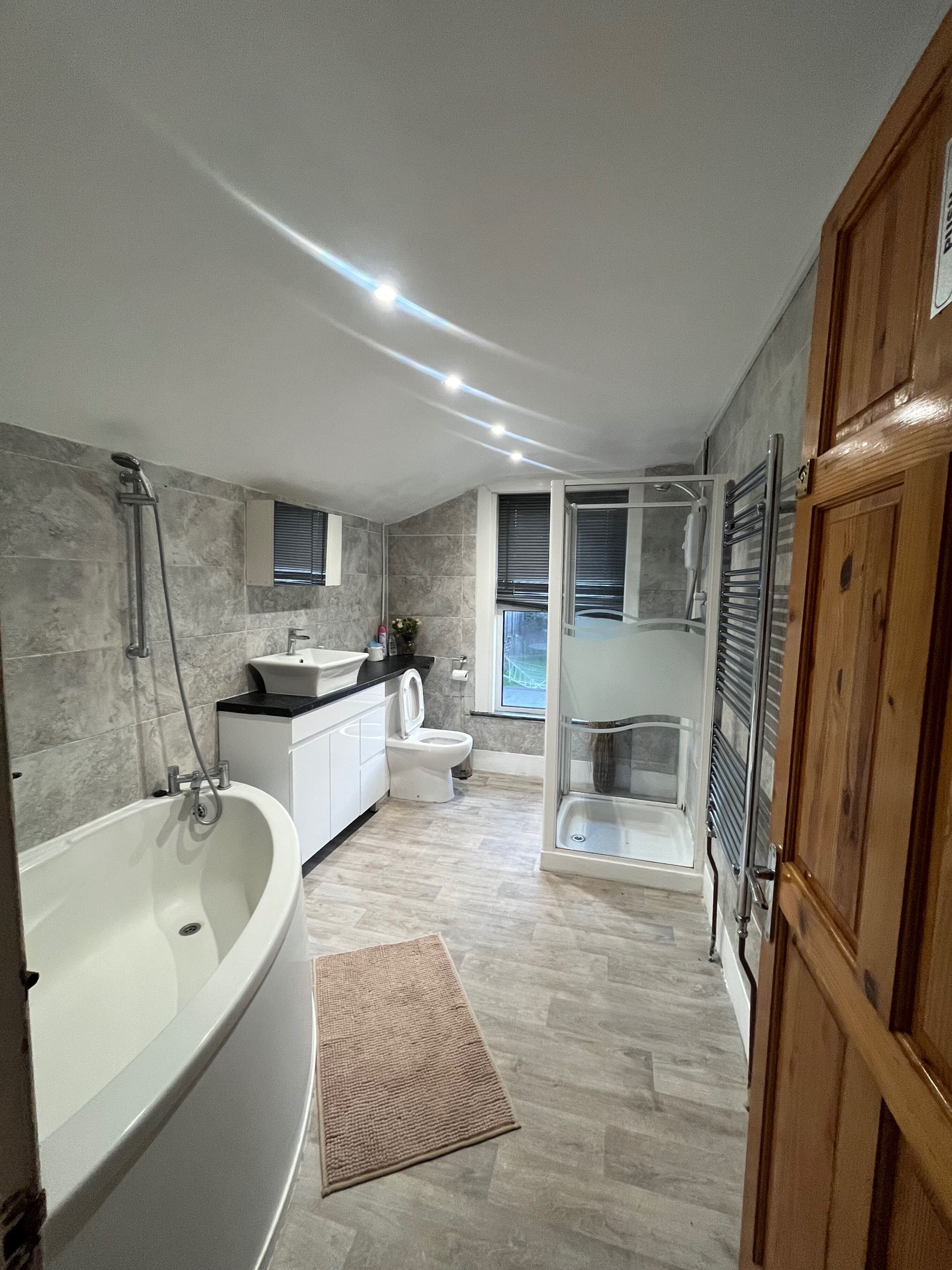 Separate bathtub and shower, deep-soaking bathtub, towels