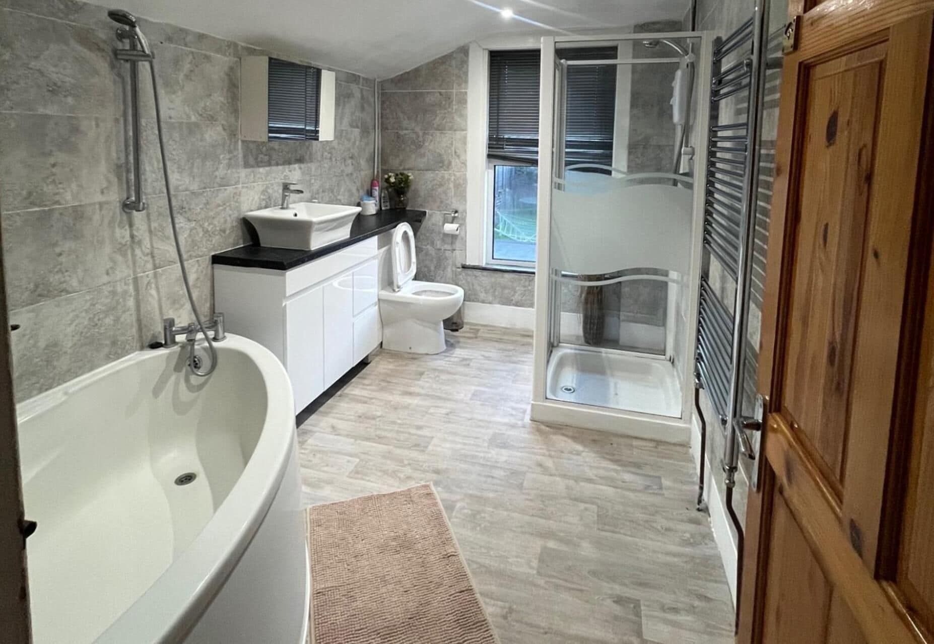 Separate tub and shower, deep soaking tub, towels