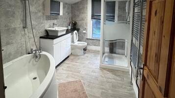 Separate tub and shower, deep soaking tub, towels