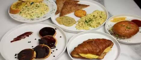 A variety of breakfast dishes on plates.