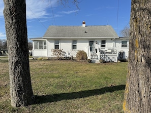 A single-story house with a front porch, a chimney, and a small front yard. - The perfect APT near everything! (Rio grande)