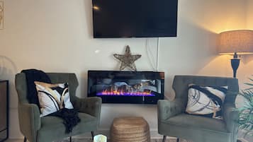 Smart TV, fireplace, books