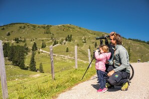 A person using a telescope on a clear day. - Luxury Apartment in Villach (75 m²) (Villach)