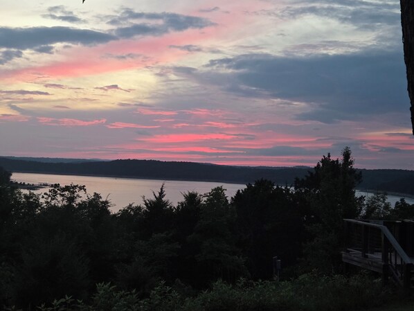 A sunset over a lake with trees in the foreground. - LAKE NORFORK cottages at a FANTASTIC FISHING resort,1-2bedrooms,electric trolley (Gamaliel)