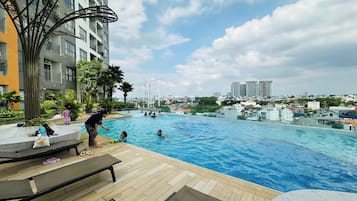 Outdoor pool, open 6:00 AM to 9:00 PM, sun loungers, lifeguards on site