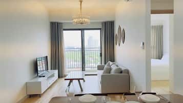 Deluxe Apartment, 1 King Bed, Balcony, River View | Living area