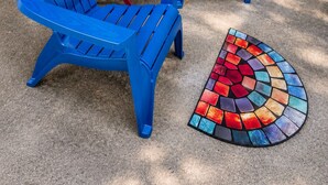 Two blue Adirondack chairs, a small red table, and a colorful mosaic outdoor rug. -  FIFA World Cup Atlanta Stay Sleeps 4 Pool 11 Min to Mercedes-Benz Stadium (Atlanta)