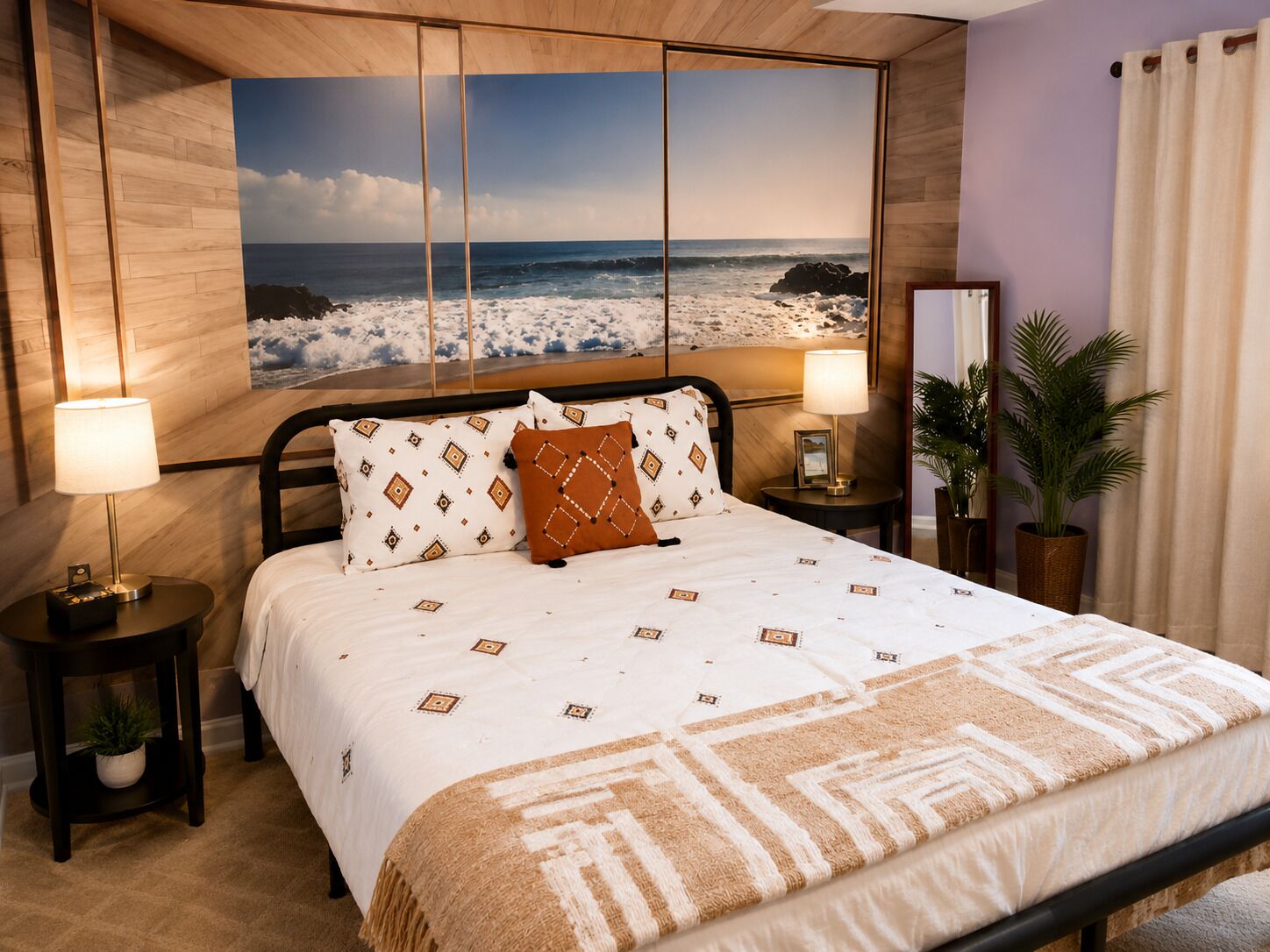 A hotel room with a bed, two bedside lamps, a nightstand, a potted plant, and a large ocean view painting on the wall..  FIFA World Cup Atlanta Stay Sleeps 4 Pool 11 Min to Mercedes-Benz Stadium