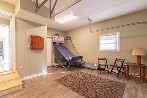 A room with a bunk bed, a desk, two chairs, a lamp, and a window. - Mountain View Retreat (Banner Elk)