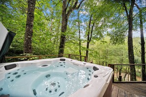 A hot tub surrounded by trees on a wooden deck. - Riverdale - 4BR With a hot Tub- Near the New River (Boone)