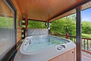 A hot tub on a wooden deck with a view of greenery. - Little Heaven - one Level! hot Tub, Multi Games, Pets Allowed, Sugar Mountain (Banner Elk)