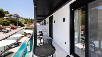 Superior Suite, Balcony, Pool View | Outdoor dining