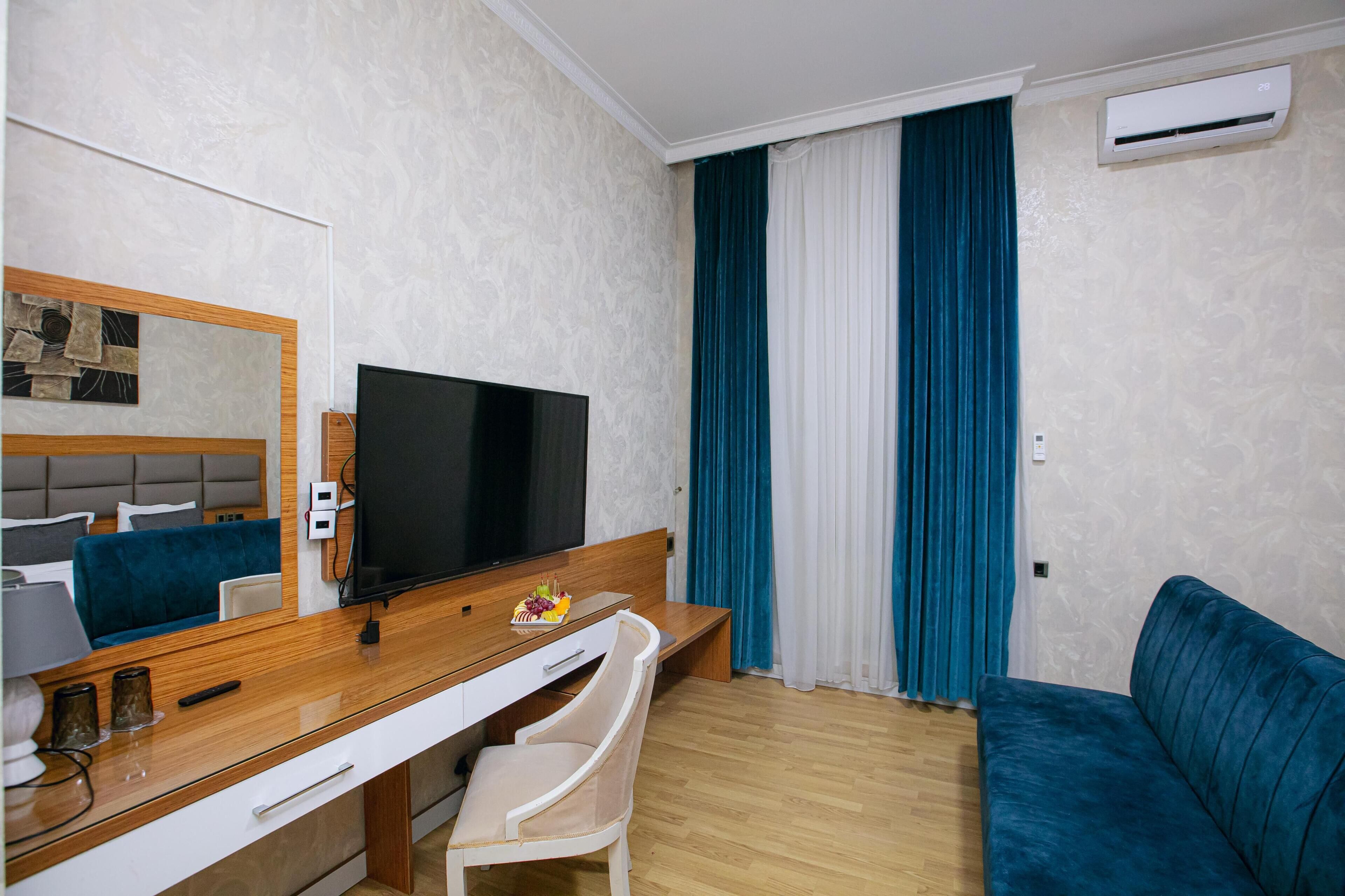 Habitación Deluxe doble, vistas a la ciudad | Zona de estar