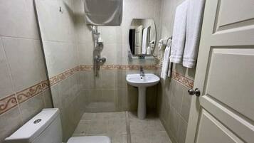 Deluxe Double Room, City View | Bathroom | Shower, hair dryer, slippers, towels