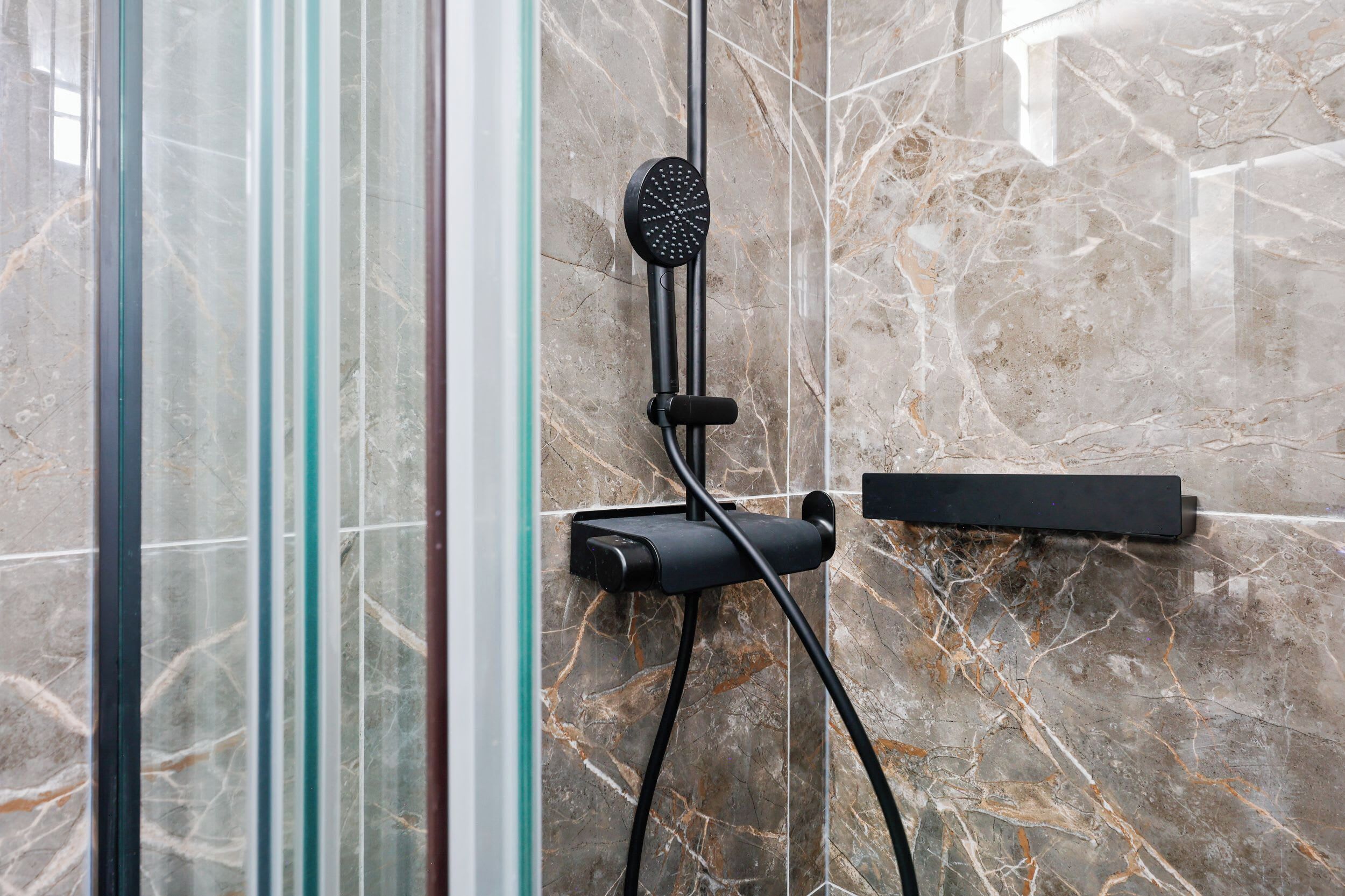 Shower, hair dryer, towels, shampoo