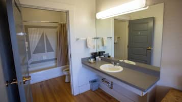 Basic Room, 2 Queen Beds, Lake View | Bathroom | Combined shower/tub, free toiletries, towels, soap