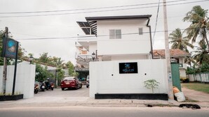 A modern two-story building with a sign that reads 'SEA LA VIE.'