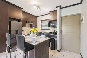 Apartment, 1 Bedroom, Patio | Dining room - Zalari Luxe Loft B, Nature 1-bed Loft, Paulshof (Johannesburg)