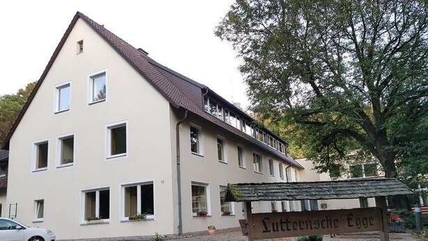 A two-story building with a sign reading 'Luttensteige Egge' in front. - Berghotel (Bad Oeynhausen)