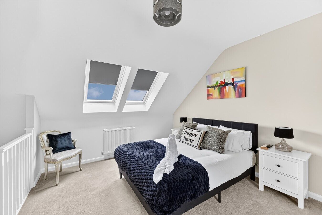 The master bedroom features a comfortable king-size bed with fresh linen and towels provided.