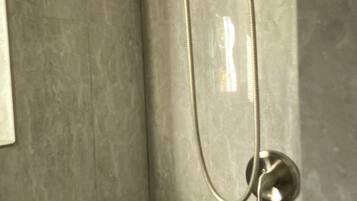Shower, towels, soap, toilet paper