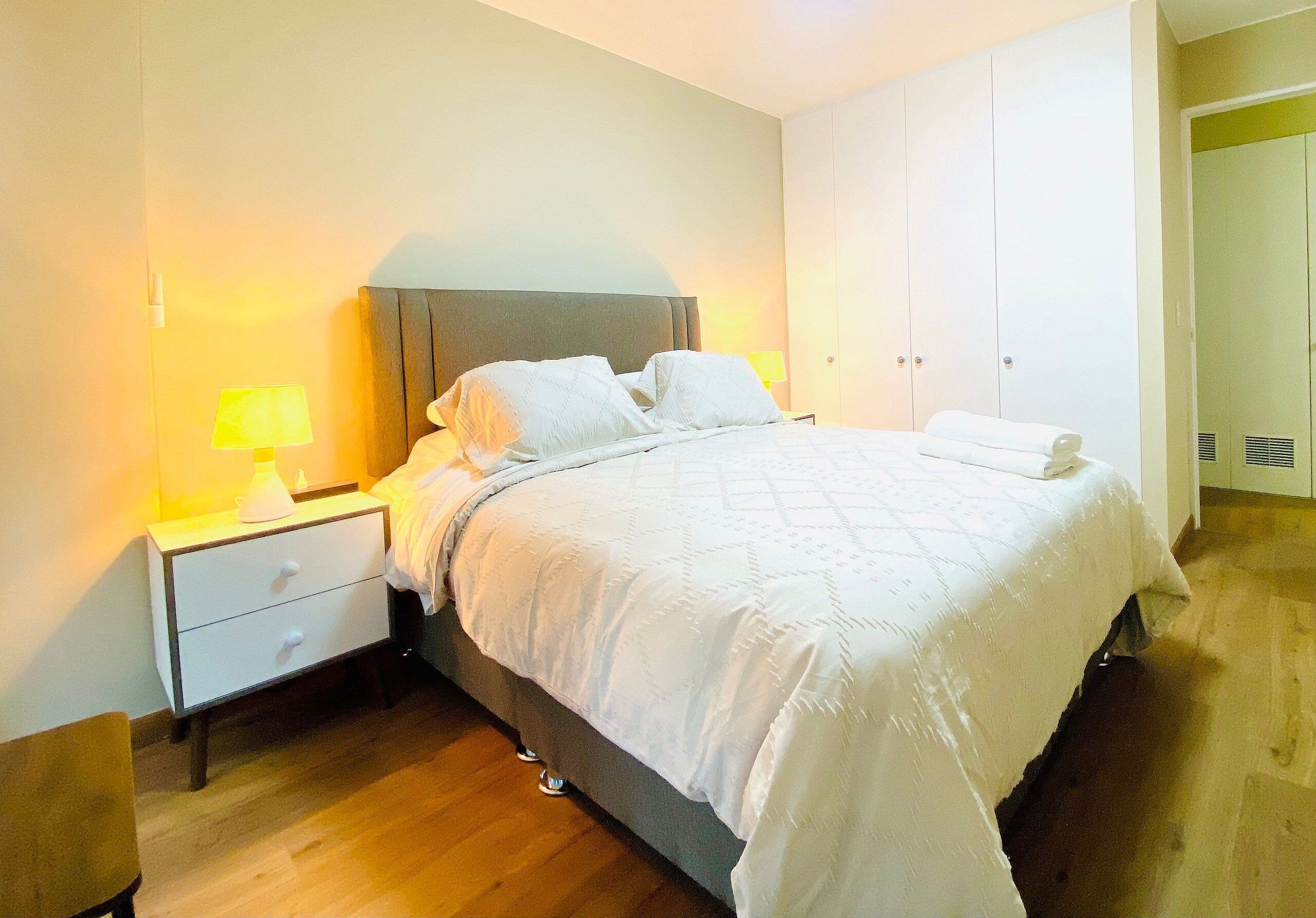 Basic Apartment | Desk, laptop workspace, blackout drapes, iron/ironing board