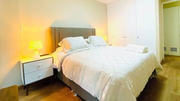 Basic Apartment | Desk, laptop workspace, blackout drapes, iron/ironing board