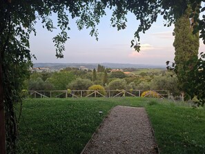 A pathway leading to a scenic view of a countryside landscape. - Il Poggio Luxury villa in Tuscany (Toscana)