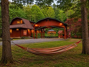 A rustic cabin with a covered porch, a gazebo, and a hammock. - Grand River Cabin I Fire Pit I Deck I Pool Table (East Stroudsburg)