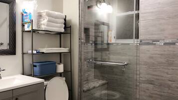 Shower, hair dryer, towels, soap
