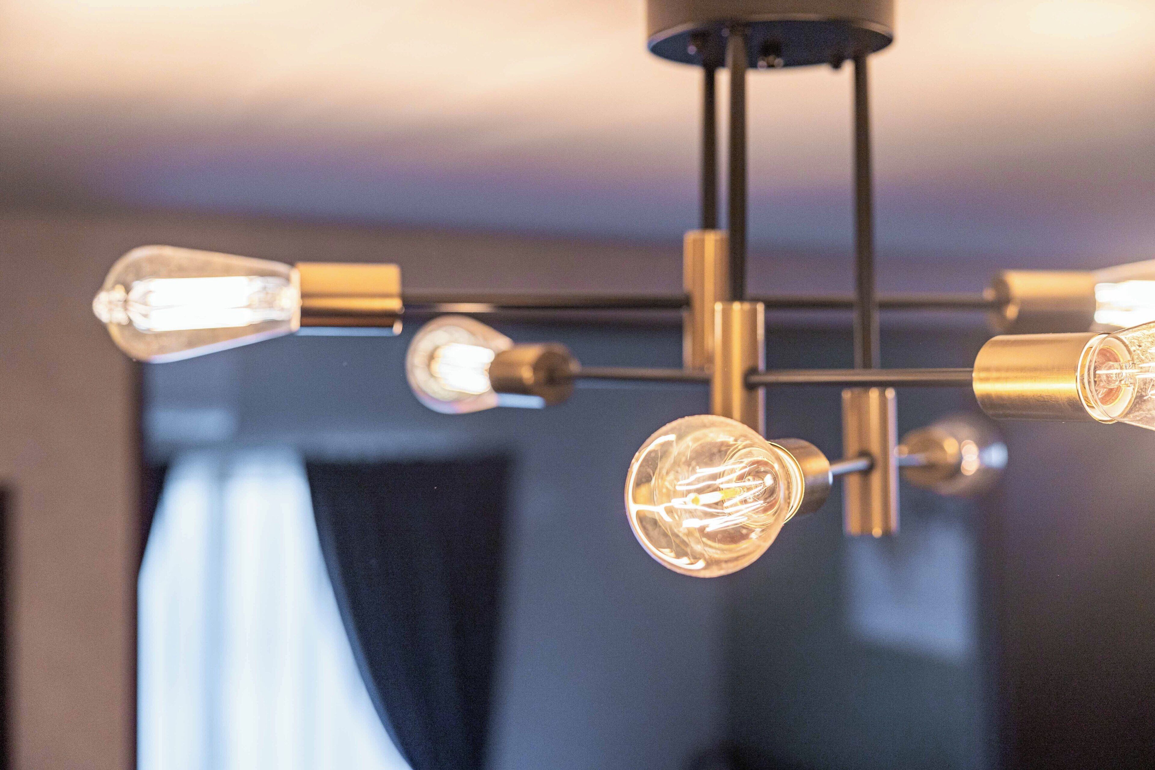 A chandelier with multiple light bulbs.
