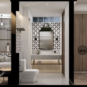 A modern bathroom with a toilet, sink, and shower area. - Nuho Living (Bingin, Uluwatu)