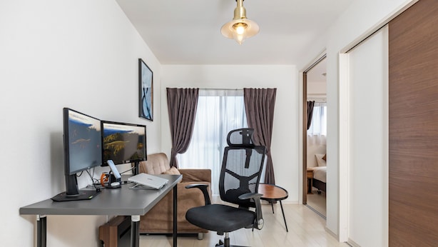 A modern office space with a desk, computer monitors, and office chair. - FDS AIM (OSAKA/NISHINARIKU/TENGACHAYA)