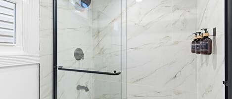 Shower, hair dryer, towels, soap