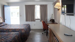 A hotel room with two beds, a desk, a chair, a television, and a window with curtains. - Stevenson Motel Federal Way Near I 5 (Federal Way)