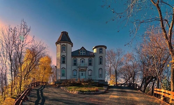 A large, historic building with a central tower, symmetrical wings, and a well-maintained lawn. - Chateau De Valvak  Spa & BBQ  Free Parking (Lévis)