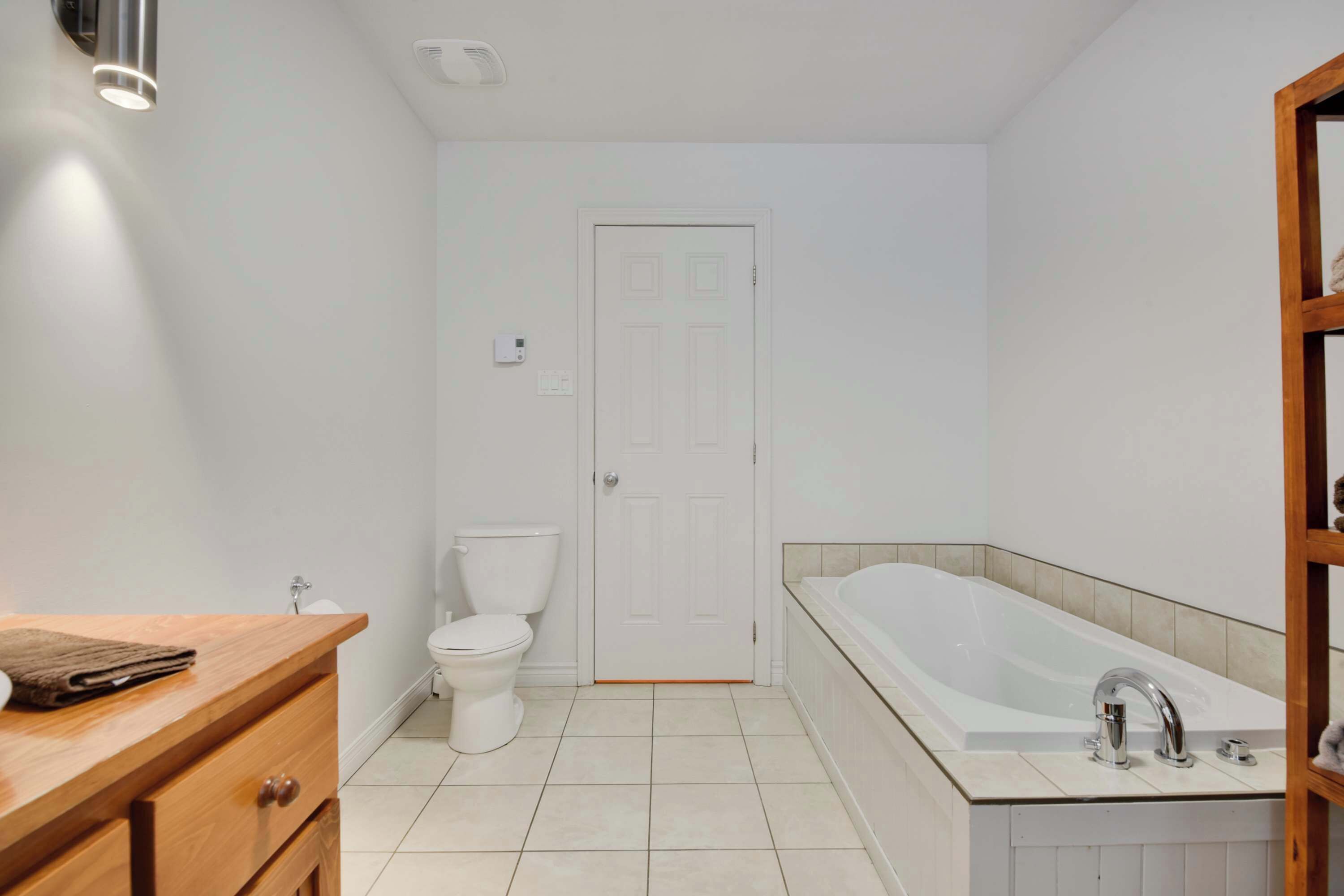 A bathroom with a toilet, a sink, and a bathtub.
