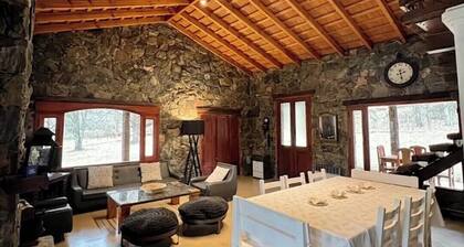 Stone house next to the El Durazno River on private property