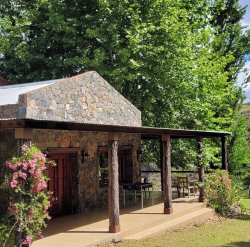 Stone house next to the El Durazno River on private property
