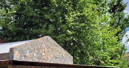 Stone house next to the El Durazno River on private property