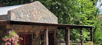Stone house next to the El Durazno River on private property
